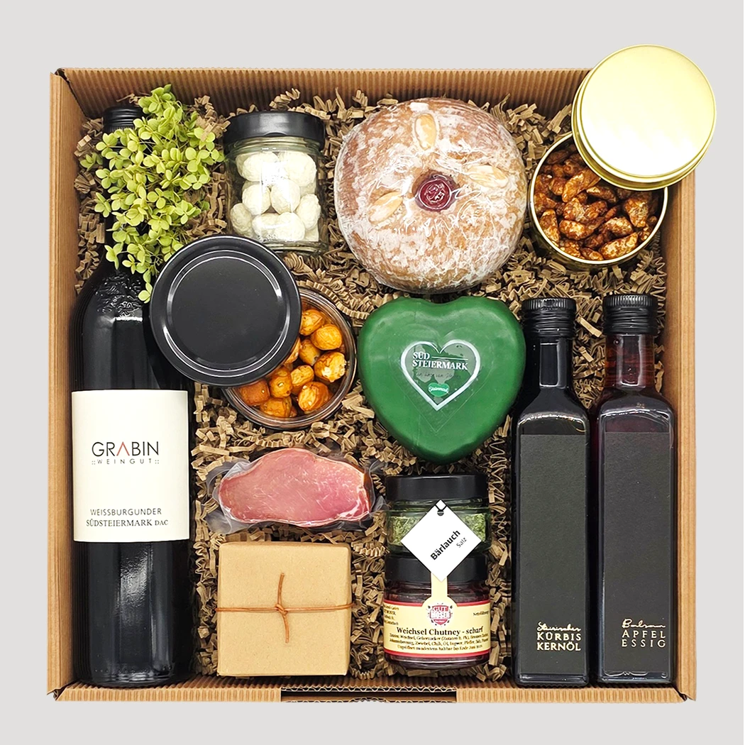 Erlesene Geschenkbox mit Wein, Schinken, Stollen, Olivenöl, Schokolade und Seife – vielseitiges Luxus-Präsent von Adam Geschenke