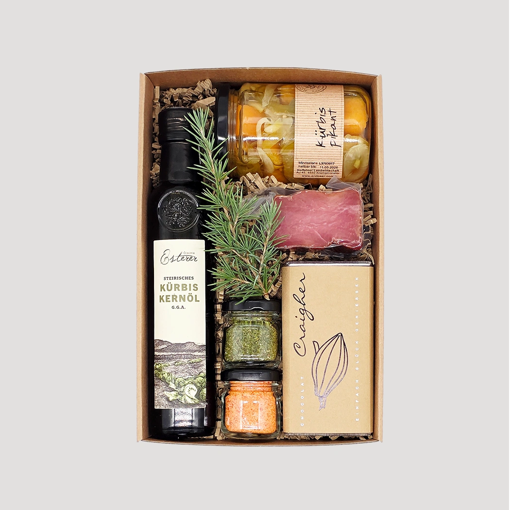 Vielfältige Geschenkbox mit Schokolade, Olivenöl, Schinken, Honig und Aufstrich – kulinarisches Geschenk von Adam Geschenke