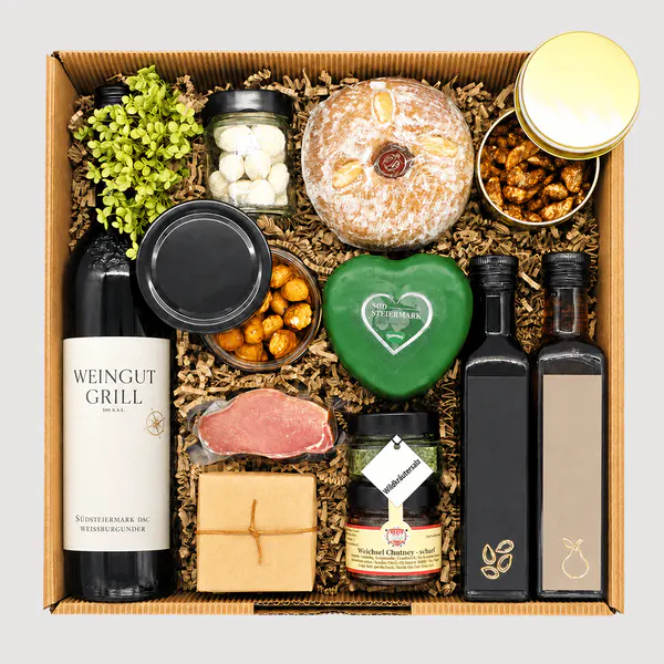 Erlesene Geschenkbox von Adam Geschenke mit steirischem Wein, Chutney, Gewürzen, Gebäck und ausgewählten süßen und herzhaften Spezialitäten
